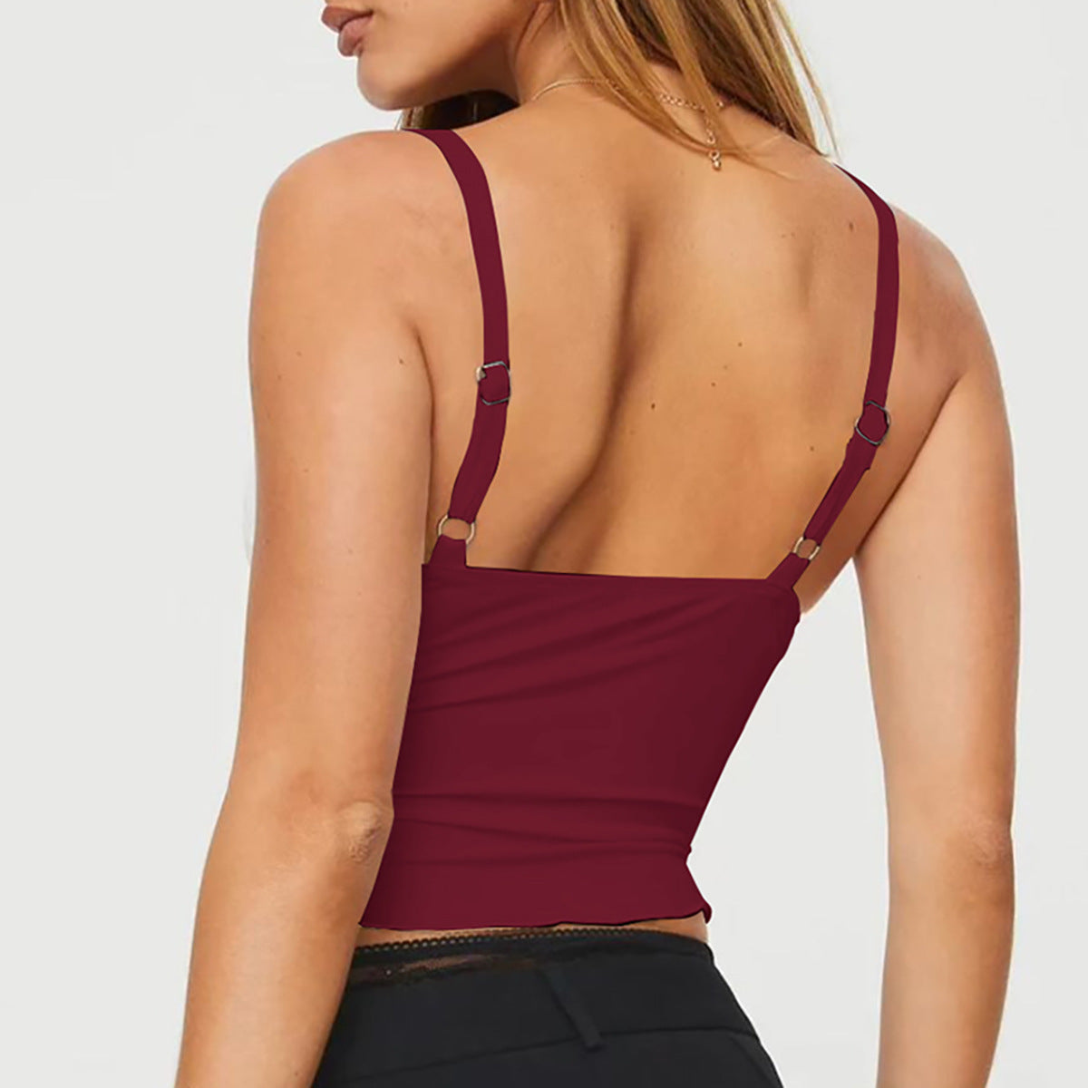 Haut femme à bretelles avec nœud, dos nu, coupe cintrée à la taille, bord ondulé, style bandeau